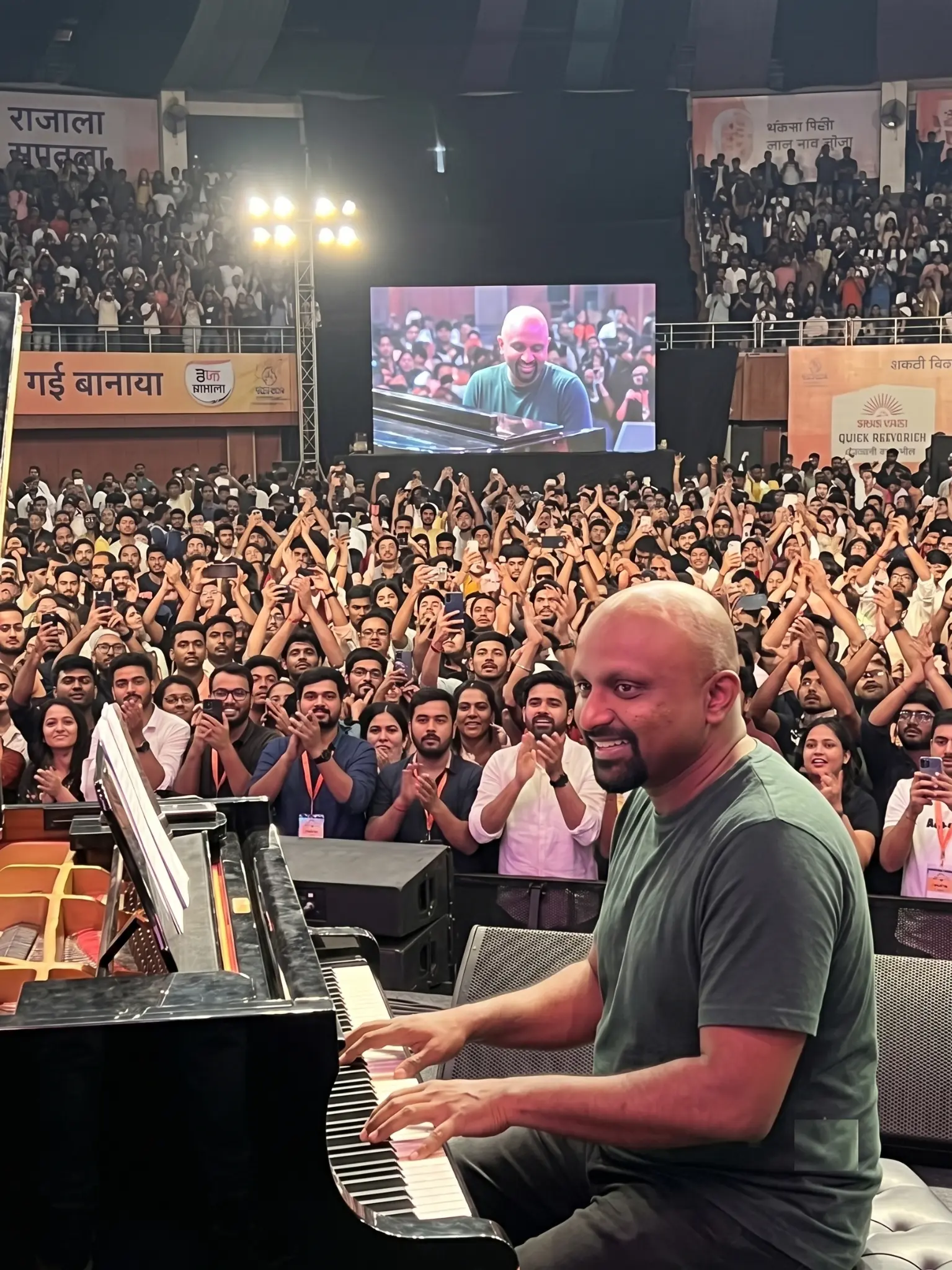 Sukeerthi Teja performing at piano with engaged audience